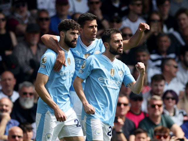 Manchester City's Josko Gvardiol celebrates scoring their first goal with Rodri and Bernardo Silva on May 11, 2024