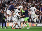 Real Madrid's Joselu celebrates scoring their second goal with teammates on May 8, 2024
