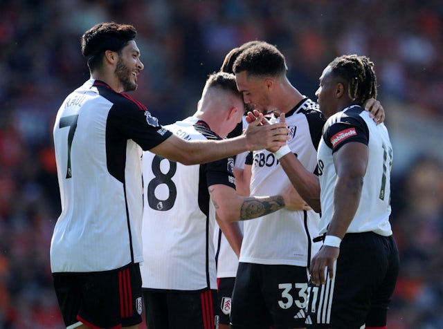 Fulham's Adama Traore celebrates scoring their first goal with Raul Jimenez on May 19, 2024