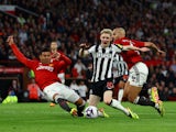 Newcastle United's Anthony Gordon in action with Manchester United's Casemiro and Sofyan Amrabat on May 15, 2024