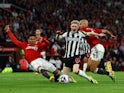 Newcastle United's Anthony Gordon in action with Manchester United's Casemiro and Sofyan Amrabat on May 15, 2024