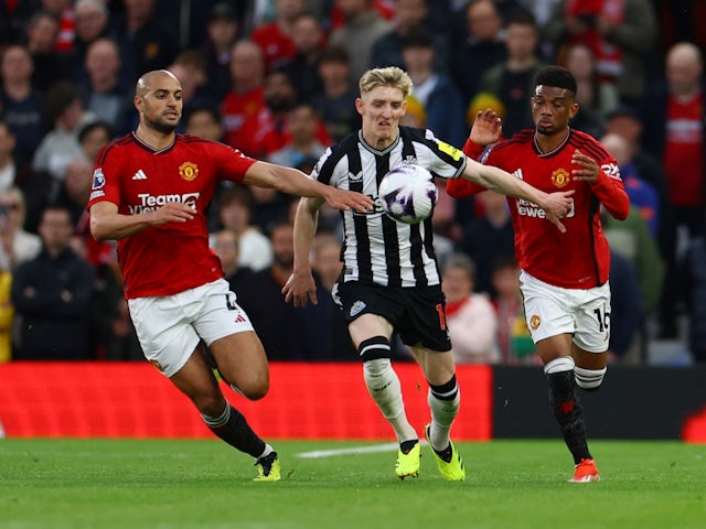 Newcastle United's Anthony Gordon in action with Manchester United's Sofyan Amrabat and Amad Diallo on May 15, 2024