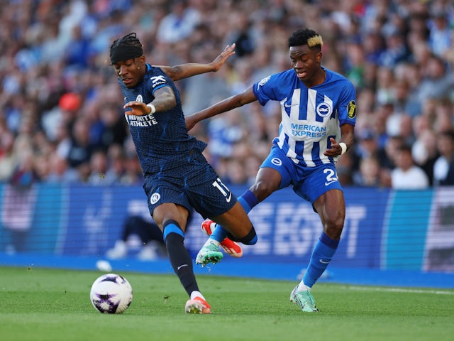Chelsea's Noni Madueke in action with Brighton & Hove Albion's Simon Adingra on May 15, 2024