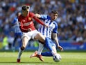 Manchester United's Alejandro Garnacho in action with Brighton & Hove Albion's Jakub Moder on May 19, 2024