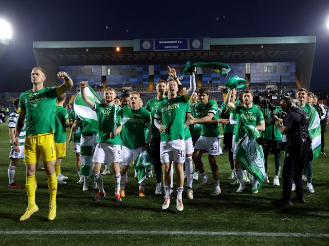 Celtic's Joe Hart with Callum McGregor and teammates celebrate after winning the Scottish Premiership on May 15, 2024