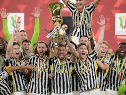 Juventus' Danilo lifts the trophy with teammates after winning the Coppa Italia final on May 15, 2024