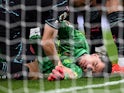 Manchester City's Ederson reacts after sustaining an injury on May 14, 2024