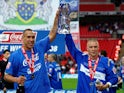 Stockport County's Liam Dickinson and Anthony Pilkington celebrate with the trophy after winning the League Two playoff final on May 26, 2008