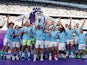 Manchester City's Kyle Walker and teammates celebrate with the trophy after winning the Premier League on May 19, 2024
