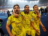 Borussia Dortmund's Mats Hummels, Emre Can and Nico Schlotterbeck celebrate after the match on May 7, 2024