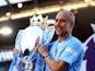 Manchester City manager Pep Guardiola celebrates with the trophy after winning the Premier League on May 19, 2024