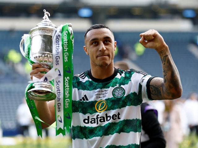 Celtic's Adam Idah celebrates with the trophy after winning the Scottish Cup on May 25, 2024