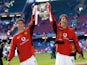 Manchester United's Cristiano Ronaldo and Ruud van Nistelrooy celebrate with the trophy after winning the FA Cup on May 22, 2004