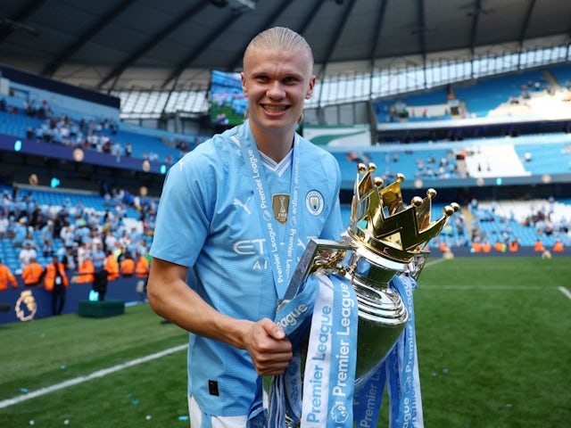Manchester City's Erling Haaland celebrates with the trophy after winning the Premier League on May 19, 2024
