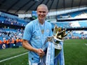 Manchester City's Erling Haaland celebrates with the trophy after winning the Premier League on May 19, 2024