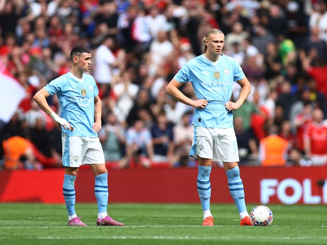 Manchester City's Phil Foden and Erling Braut Haaland look dejected on May 25, 2024