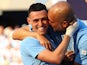 Manchester City manager Pep Guardiola celebrates with Phil Foden after winning the Premier League on May 19, 2024