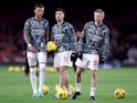 Arsenal's Ben White, Gabriel Martinelli and Oleksandr Zinchenko during the warm up before the match in December 2023