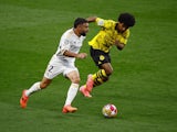 Real Madrid's Dani Carvajal in action with Borussia Dortmund's Karim Adeyemi on June 1, 2024