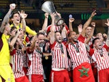 Olympiacos' Kostas Fortounis celebrates with the trophy after winning the Europa Conference League on May 30, 2024