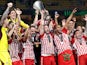 Olympiacos' Kostas Fortounis celebrates with the trophy after winning the Europa Conference League on May 30, 2024