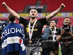Southampton's Taylor Harwood-Bellis celebrates after winning the Championship Play-Off final on May 23, 2024