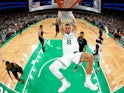 Boston Celtics center Kristaps Porzingis dunks the ball against the Dallas Mavericks on June 7, 2024