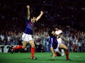 France's Michel Platini (R) celebrates after scoring the winning goal in extra time of a Euro 1984 semi-final on June 23, 1984