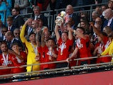 Manchester United's Jonny Evans celebrates with the trophy after winning the FA Cup on May 25, 2024