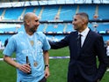 Manchester City manager Pep Guardiola celebrates with chairman Khaldoon Al Mubarak after winning the Premier League on May 19, 2024