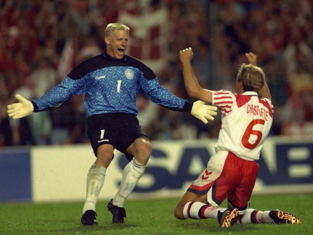 Denmark's Peter Schmeichel celebrates with teammate Kim Christofte after winning a penalty shootout at Euro 1992 on June 22, 1982