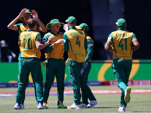  South Africa's David Miller celebrates with teammates after taking the wicket of Netherlands' Bas de Leede on June 5, 2024
