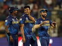 Sri Lanka's Maheesh Theekshana celebrates with teammates after taking the wicket of New Zealand's Rachin Ravindra on June 5, 2024