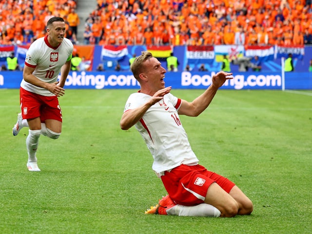 Poland forward Adam Buksa celebrates scoring against Netherlands on June 16, 2024.