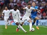 England's John Stones in action with Iceland's Jon Dagur Thorsteinsson on June 7, 2024
