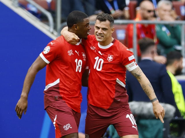 Switzerland's Kwadwo Duah celebrates scoring their first goal with Granit Xhaka on June 15, 2024