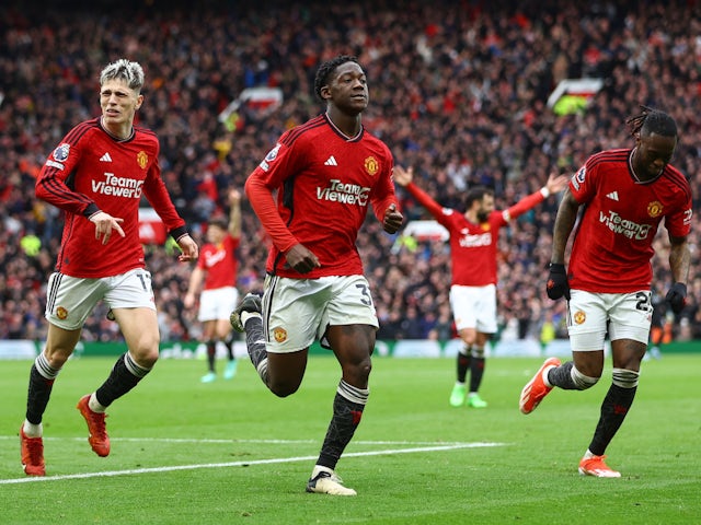 Manchester United's Kobbie Mainoo celebrates scoring their second goal with Aaron Wan-Bissaka and Alejandro Garnacho on April 7, 2024