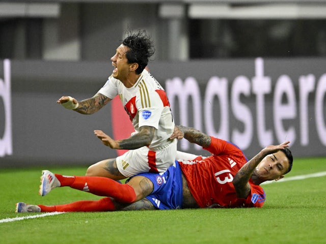 Gianluca Lapadula of Peru reacts to a challenge during their opening match of the 2024 Copa America