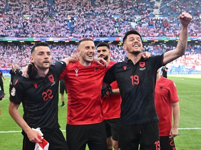 Albania's Amir Abrashi and Mirlind Daku celebrate after the match on June 19, 2024 [IMAGO]