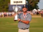 Bryson DeChambeau celebrates with the trophy after winning the U.S. Open golf tournament on June 16, 2024