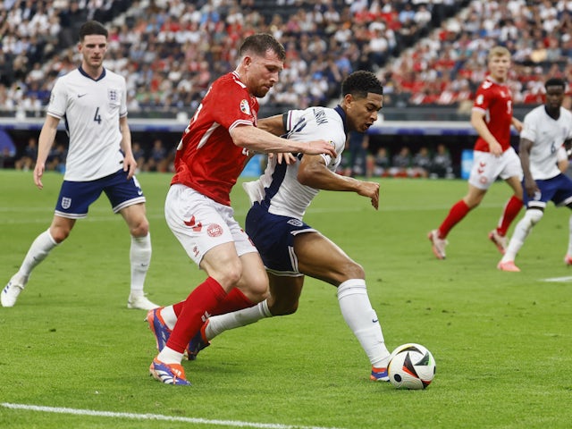 Denmark's Pierre-Emile Hojbjerg in action with England's Jude Bellingham on June 20, 2024