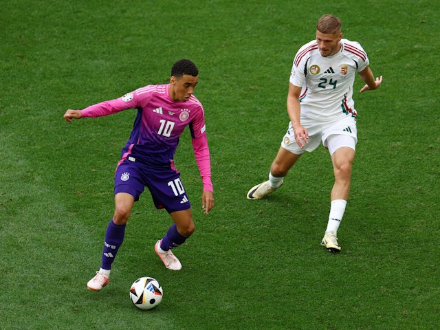 Germany's Jamal Musiala in action with Hungary's Marton Dardai on June 19, 2024