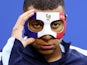 France's Kylian Mbappe wears a protective mask during training on June 20, 2024