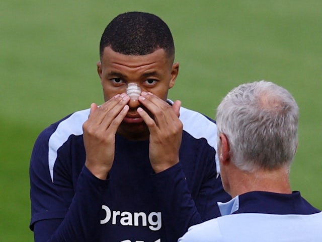France's Kylian Mbappe holds his nose plasters on June 21, 2024