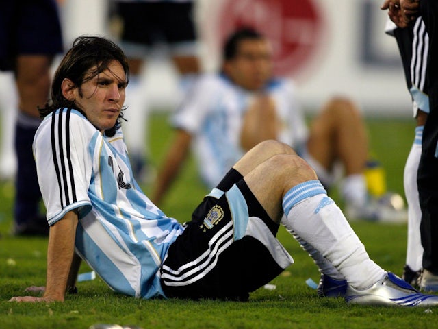 Argentina's Lionel Messi sits on the field after their loss to Brazil in the Copa America final on July 15, 2007