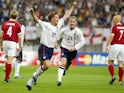 England's Michael Owen celebrates scoring their second goal with Nicky Butt on June 15, 2002
