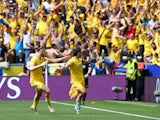 Romania's Nicolae Stanciu celebrates scoring their first goal with Radu Dragusin on June 17, 2024