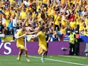 Romania's Nicolae Stanciu celebrates scoring their first goal with Radu Dragusin on June 17, 2024