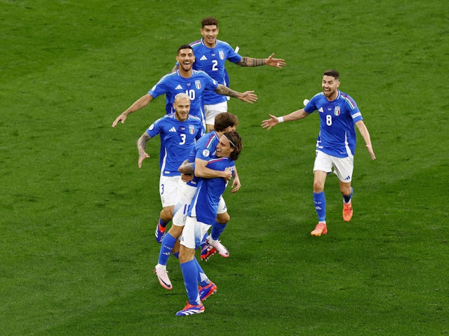 Italy's Nicolo Barella celebrates scoring their second goal with Riccardo Calafiori and teammates on June 15, 2024