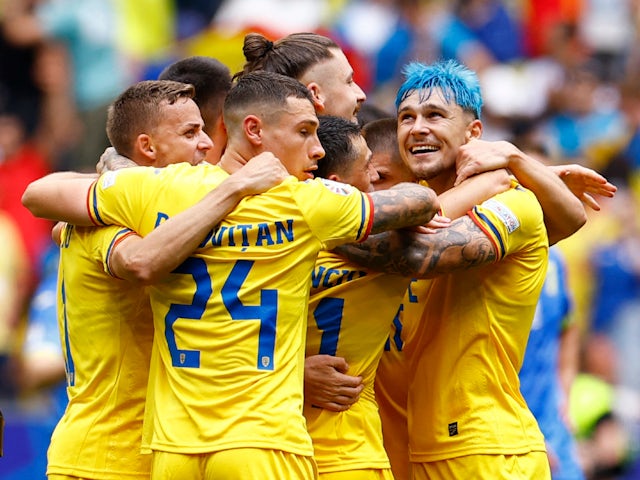 Romania's Bogdan Racovitan, Andrei Ratiu and teammates celebrate after the match on June 17, 2024